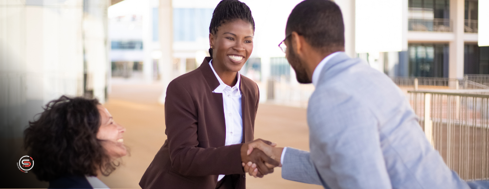 customer and company rep shake hands